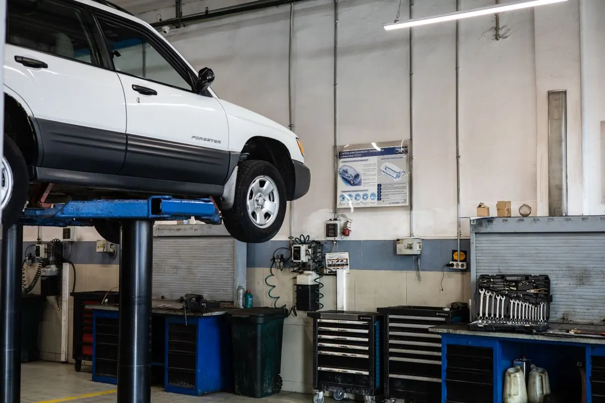 A car up on the lift in the workshop