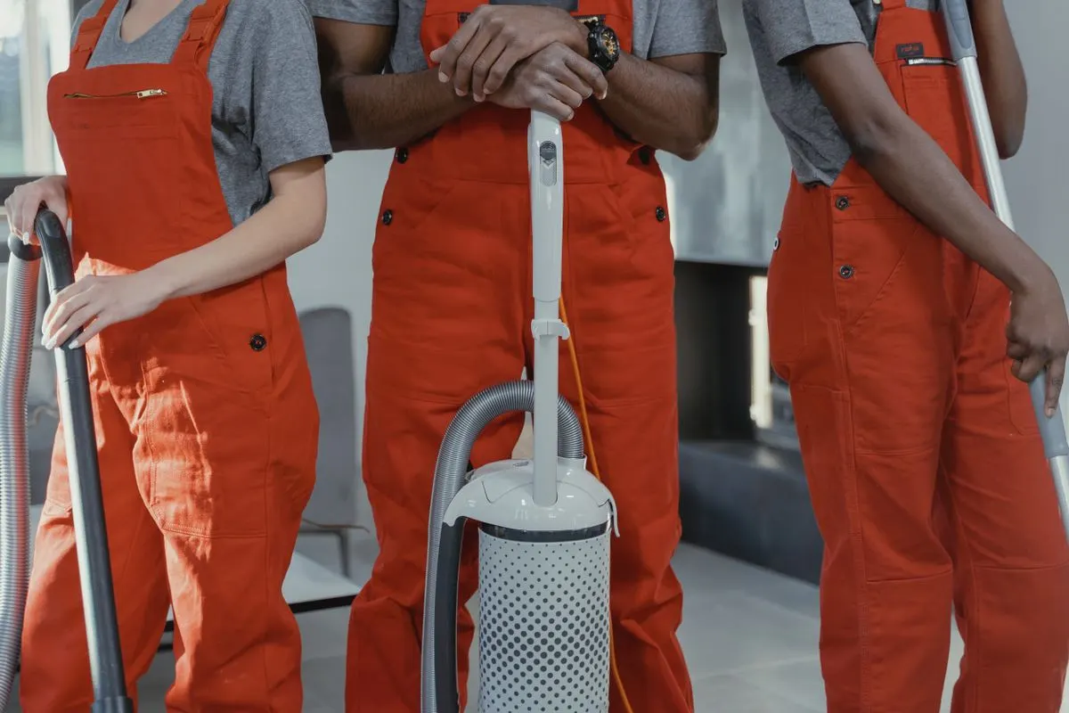 A cleaning team ready with their equipment